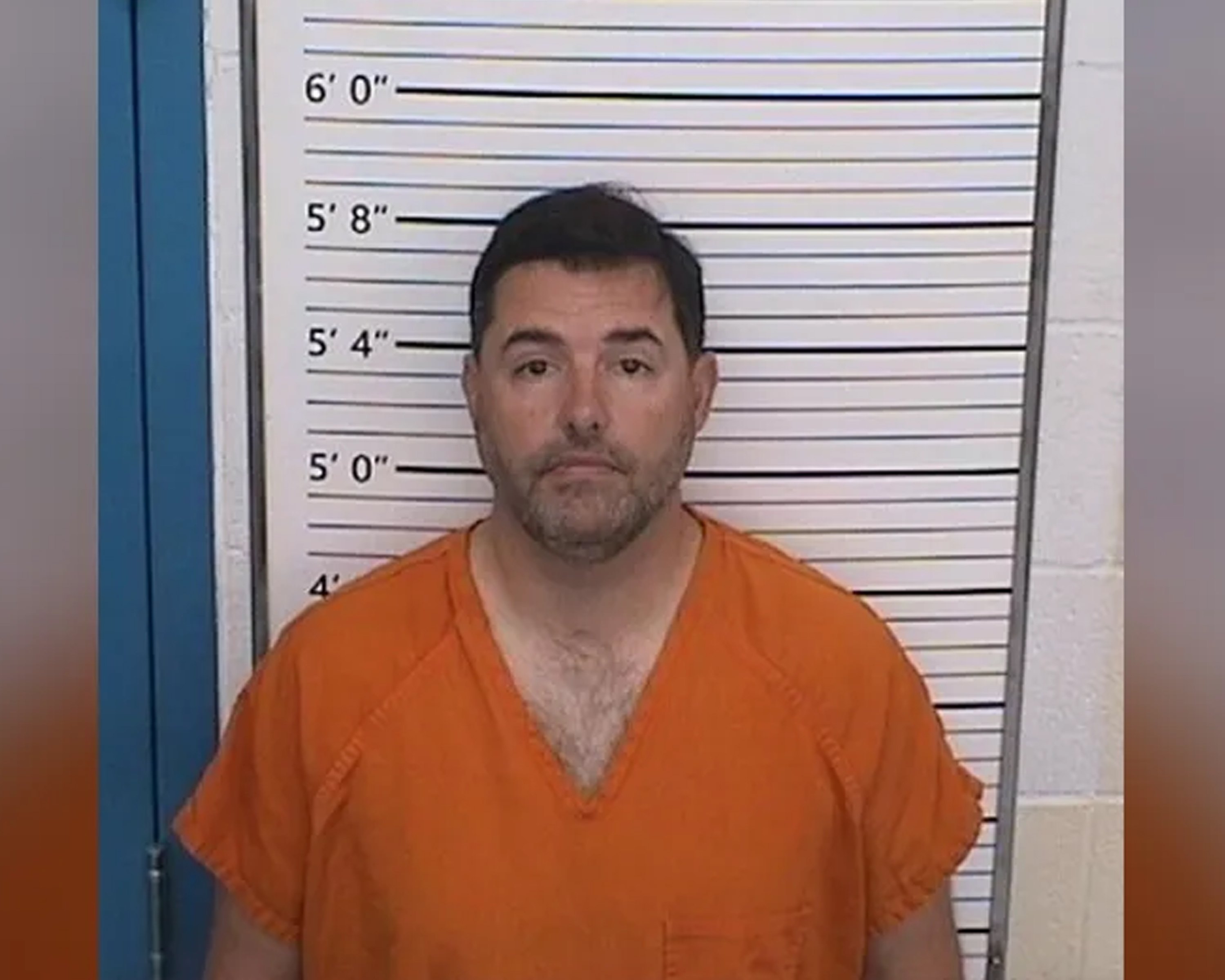 Booking photograph of Jed York from the Columbiana County Jail, August 23, 2026. He faces the camera in an orange jail uniform in front of a height chart.